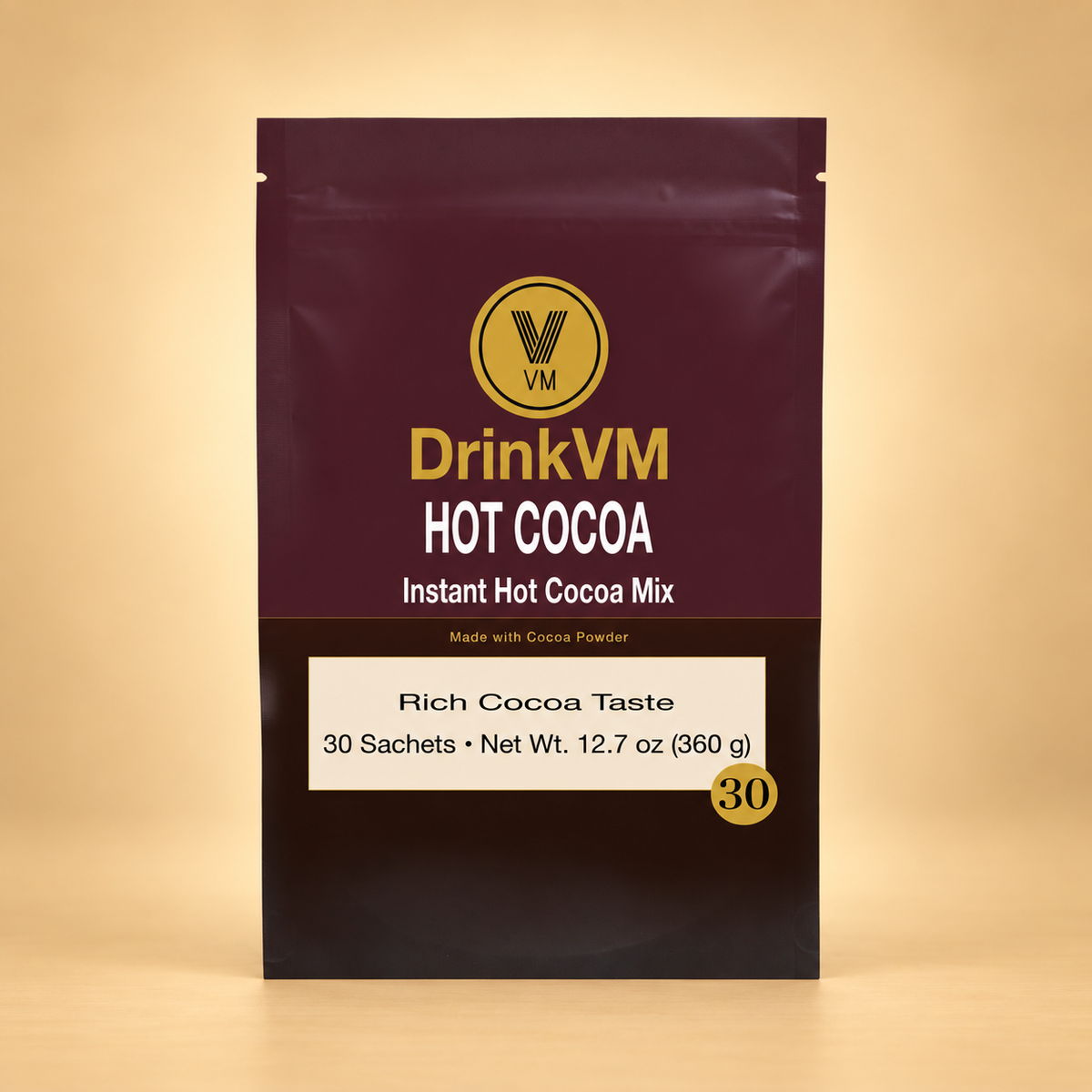 DrinkVM Instant Hot Cocoa Mix 30-sachet pouch on a warm beige background